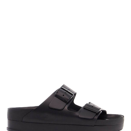 Birkenstock black leather platform sandals with two straps and metal buckles