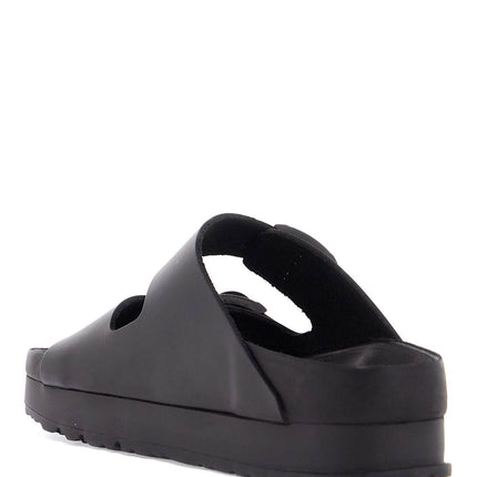 Birkenstock black leather platform sandals with two straps and metal buckles