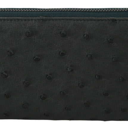 Exquisita cartera continental de piel de avestruz verde