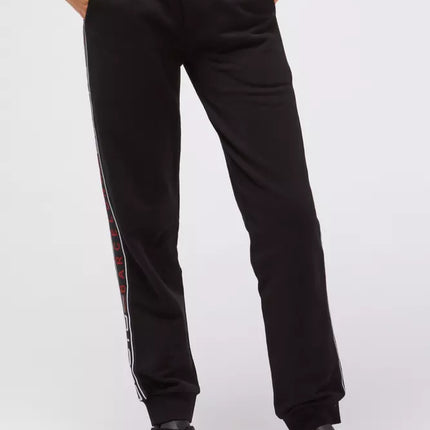 Pantalones de chándal negro elegantes con bandas laterales del logotipo