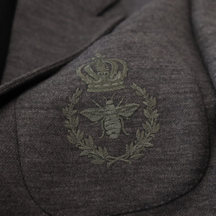 Blazer élégant en laine gris avec broderie de la couronne d'abeille