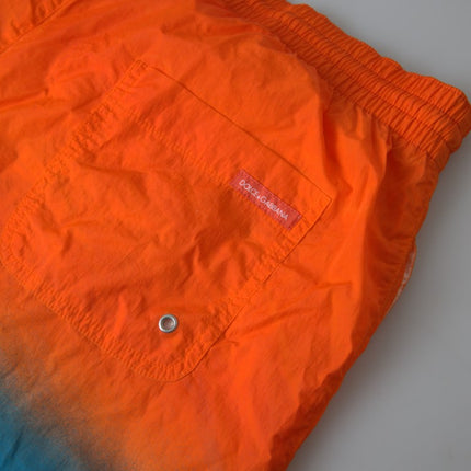 Pantalones cortos de natación de efecto de gradiente en naranja vibrante