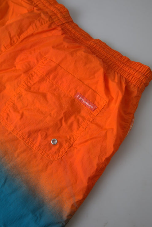 Pantalones cortos de natación de efecto de gradiente en naranja vibrante