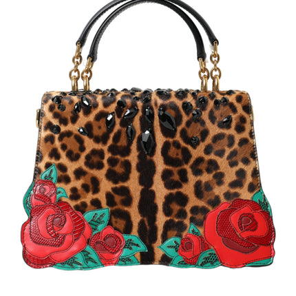 Elegante bolso de mano adornado con leopardo y rosas rojas