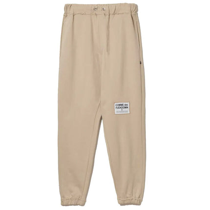 Pantalones de chándal de algodón beige elegantes con detalles deshilachados