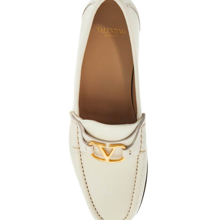 Valentino Garavani ivory leather loafer with golden metal v logo