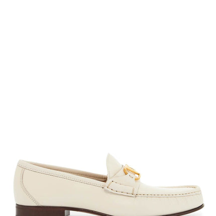 Valentino Garavani ivory leather loafer with golden metal v logo