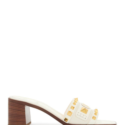 Valentino Garavani ivory leather slippers with golden studs and low heel