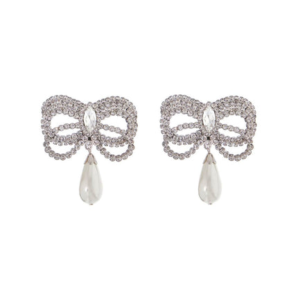 Alessandra Rich hypoallergenic brass earrings in silver with bow and drop pearl